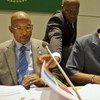 Ibahim Assane Mayaki of NEPAD (left) and UNAIDS Executive Director Michel Sidibé sign agreement in Addis Ababa, Ethiopia.