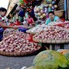 For many women in Myanmar, selling vegetables in the open market is one of the few sources of cash income.