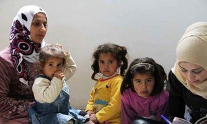 Members of a Syrian family register as refugees in northern Lebanon.