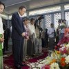 Ban Ki-moon and wife Yoo Soon-taek, along relatives of former UN Secretary-General U Thant, pay their respects at his memorial in Yangon.