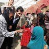 UN humanitarian chief Valerie Amos (left), jokes with a group of young girls at a refugee camp in the Parwan Se district of Kabul, Afghanistan.