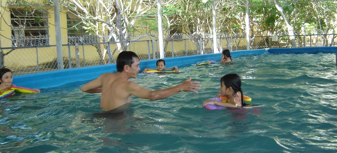 Water familiarisation in one of 10 SwimSafe portable pools in Danang, Viet Nam.