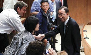 Secretary-General Ban Ki-moon (right) greets journalists before his briefing on the upcoming UN Sustainable Development Conference.