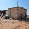 UNSMIS staff in the Syrian village of Mazraat al-Qubeir conduct a fact-finding mission.