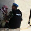 An observer with the UN Supervision in Syria interviews a local man while conducting a fact-finding mission in the village of Mazraat al-Qubeir.