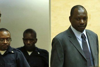 Thomas Lubanga Dyilo (right) listens to his sentence of 14 years being handed down in Courtroom I of the International Criminal Court.