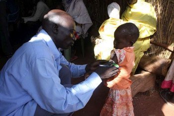 A new arrival in South Sudan's Yida camp gets her arm measured as part of malnutrition screening.