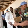 UNAMID Force Commander Patrick Nyamvumba hands out medical supplies in Kutum, North Darfur.