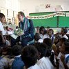 Secretary-General Ban Ki-moon interacts with children on his visit to the Cassait Primary School in Liquica district, Timor-Leste.