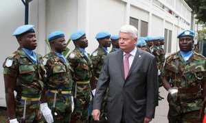 Peacekeeping chief Hervé Ladsous reviews an honour guard of the UN mission in the Democratic Republic of the Congo, MONUSCO.