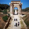 A family saunters down the main approach to Leptis Magna, the largest in scale of Libya’s Roman-era Decapolis (Ten Cities).