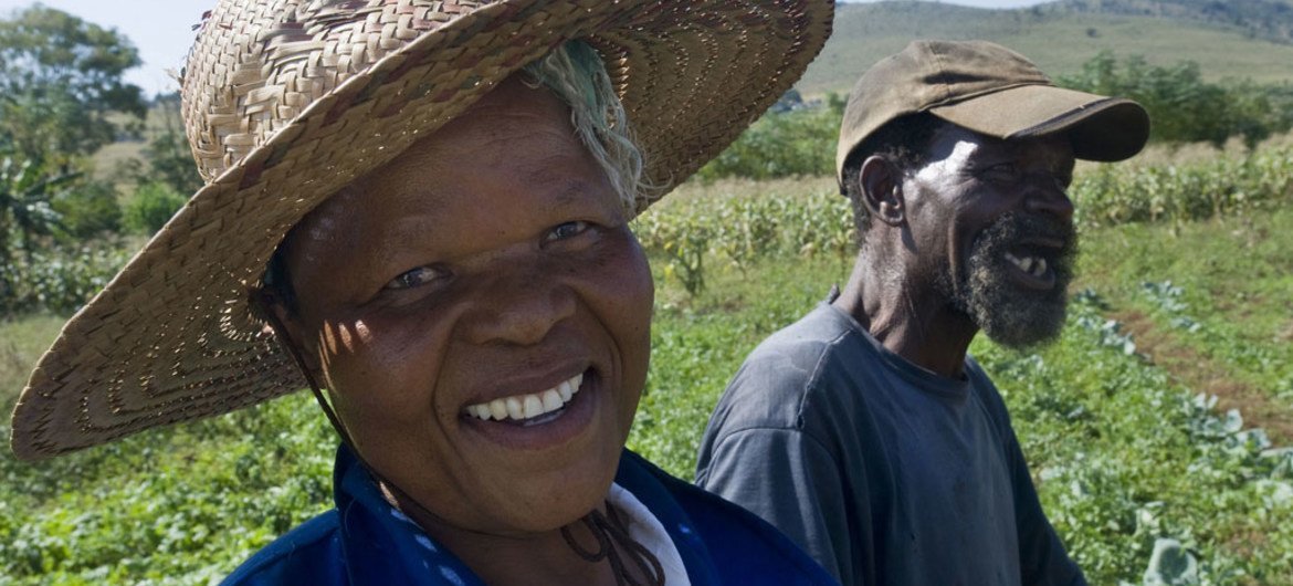 A farmer and his wife working in a vegetable plot irrigated by water from the Mpatheni Dam in Swaziland.