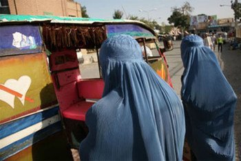 Afghan women bargain with a rickshaw driver in the city of Herat.