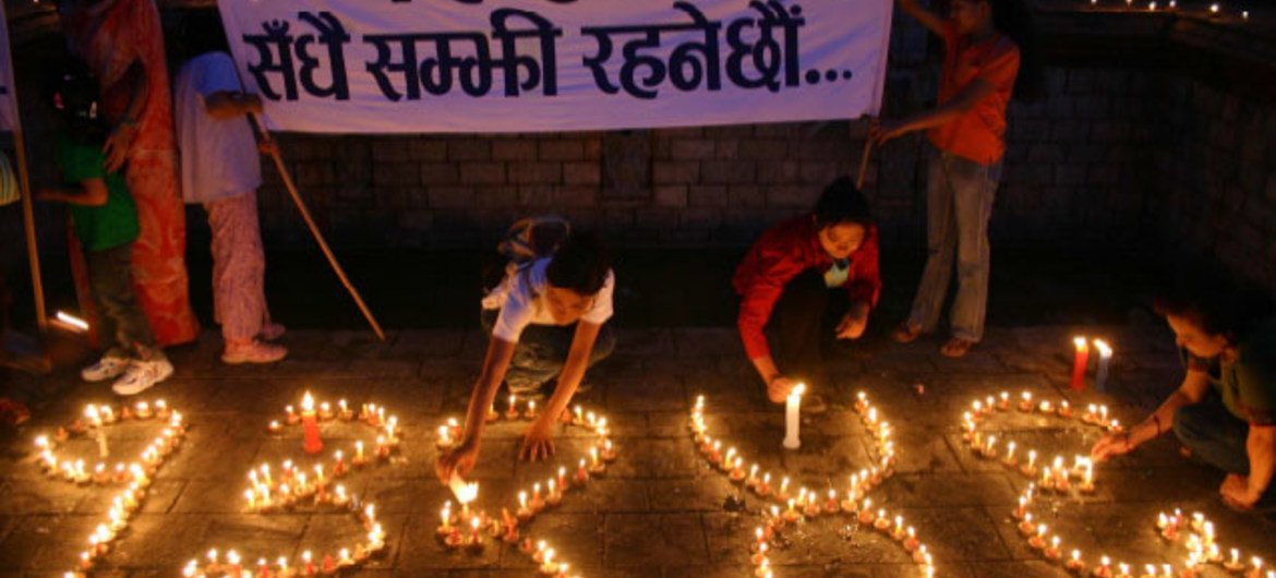 Candles at a memorial event form the number 13,246, the official count of Nepalis killed as of May 2006.