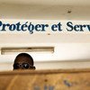 "Protéger et servir",  devise de la police haïtienne.