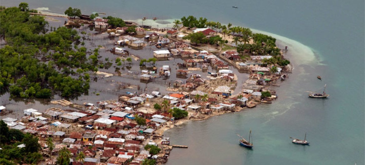 Hurricane Sandy passed to the west of Haiti causing heavy rains and winds, flooding homes and overflowing rivers.