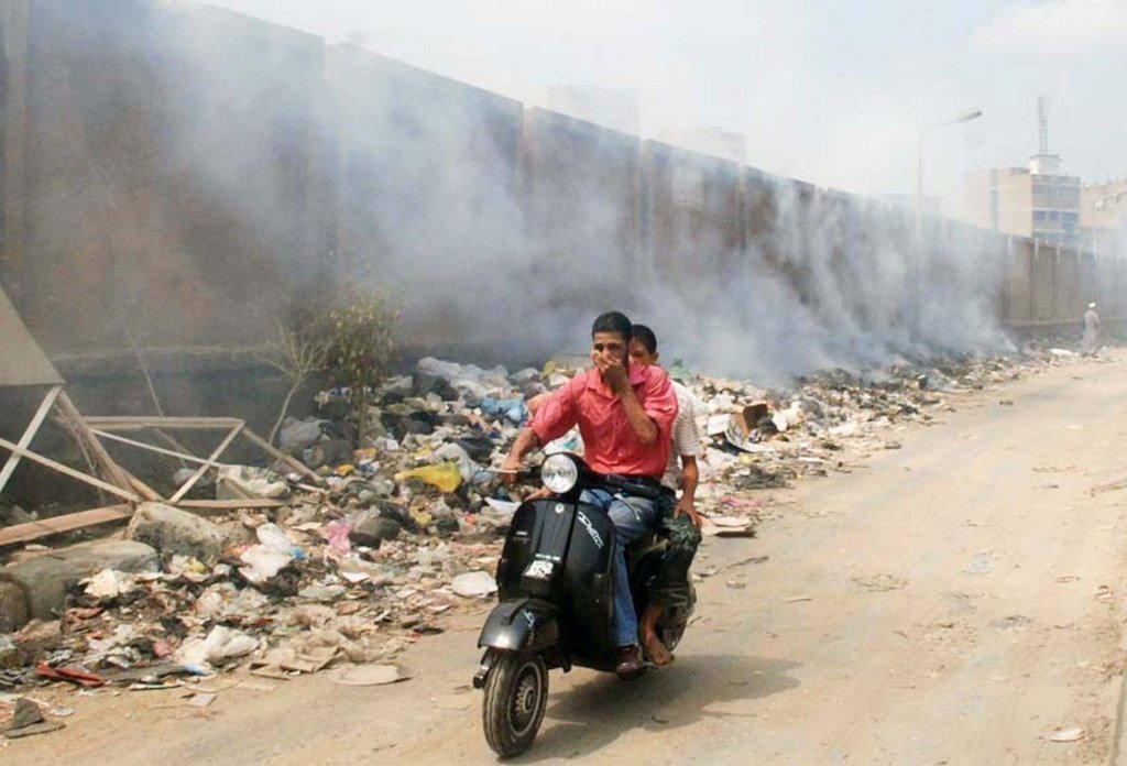 Piles of garbage being burned in the streets of Cairo, Egypt.