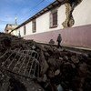 A man walks through rubble in the city of San Marcos, Guatemala, after a 7.2 earthquake rocked the Central American country, killing dozens of people.