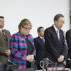 Secretary-General Ban Ki-moon (second right) and General Assembly President Vuk Jeremic (right) observing a moment of silence at the start of a briefing to the Assembly on the impact of Hurricane Sandy.