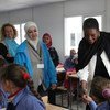 UN humanitarian chief Valerie Amos (right) meets with school children during a visit to Za’atri Refugee Camp in Jordan on 27 November 2012.