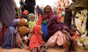 Women and children wait for assistance from the drought/famine in Dolo, southern Somalia.
