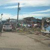 People of Cateel in the Philippines start to clean up debris after Typhoon Bopha devastated the town.