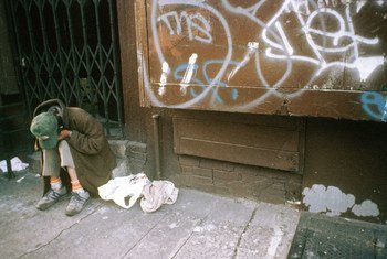 A homeless man sits at the steps of a store in lower east side, Manhattan, New York City. (File)