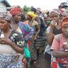 Women wait for food to be distributed at the Mugunga III camp in the Democratic Republic of the Congo (DRC).