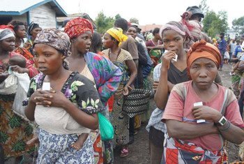 Women wait for food to be distributed at the Mugunga III camp in the Democratic Republic of the Congo (DRC).