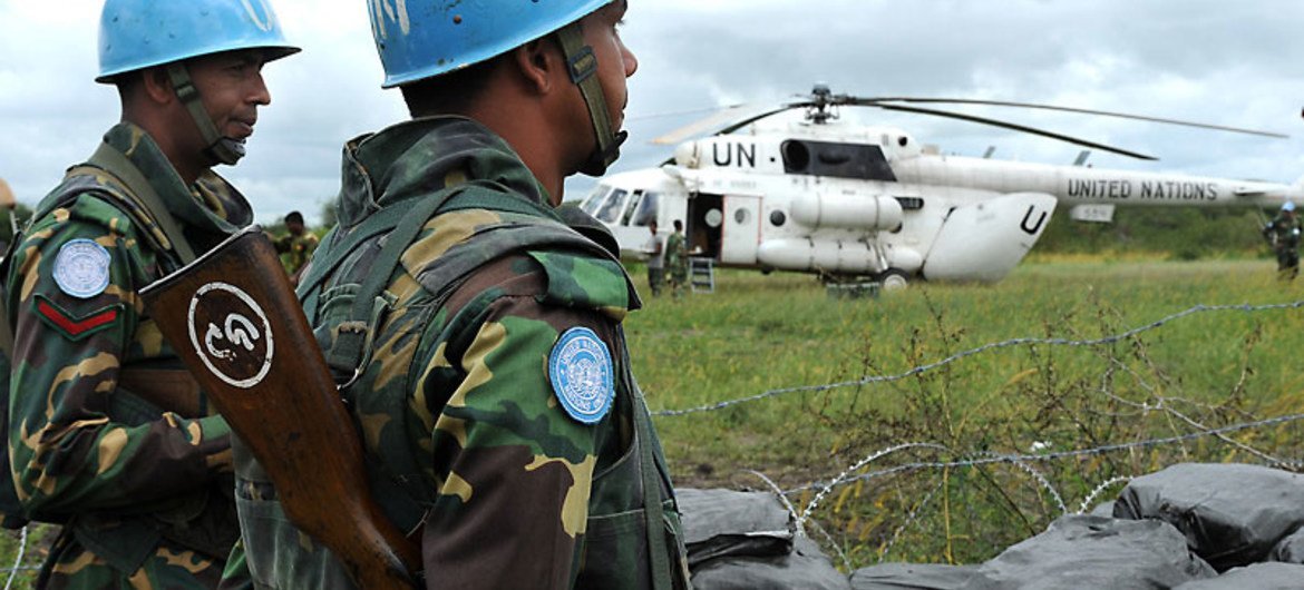 UN peacekeepers in South Sudan with one of their helicopters.