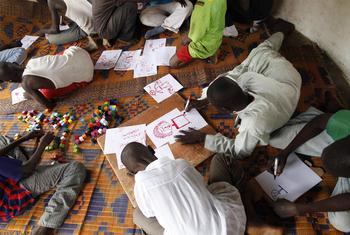 Former child soldiers draw in a UNICEF-assisted transit centre in the Central African Republic (CAR).