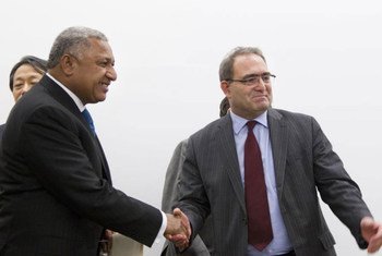 Ambassador Mourad Benmehidi of Algeria (right) hands over the chairmanship of the ‘G-77’ to Commodore Josaia V. Bainimarama, the Prime Minister of Fiji.