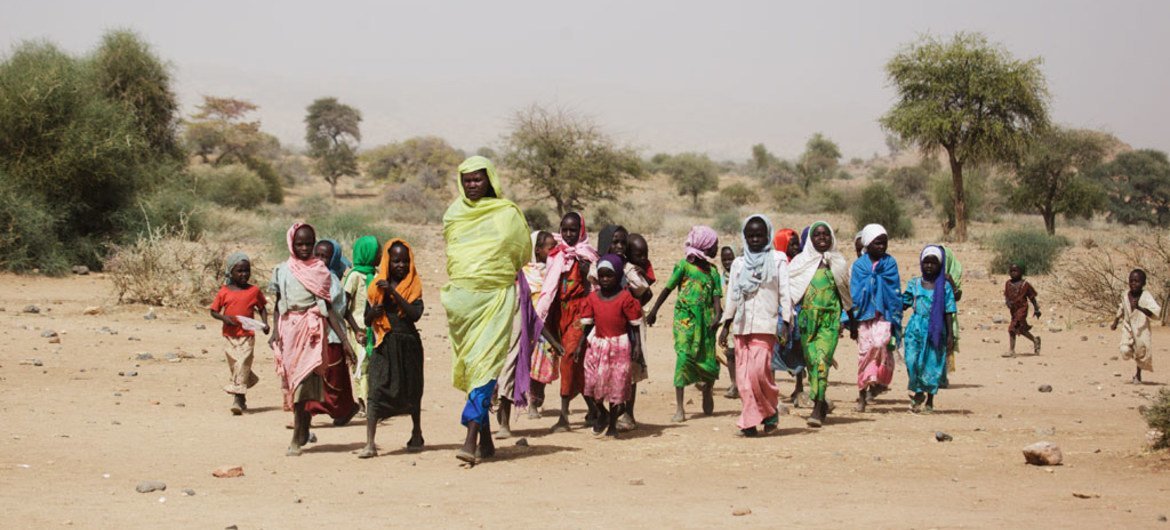 A Sudanese woman and children in Fanga Suk in East Jebel Marra, South Darfur.