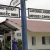 A signpost at the Ocean Road Cancer Institute in Dar es Salaam, Tanzania, indicating different sections of the hospital.