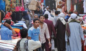 People passing through a busy market in Khan El-Khalili District, Cairo, Egypt. ILO/M. Crozet