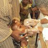 Health workers vaccinating children against polio in Nigeria.