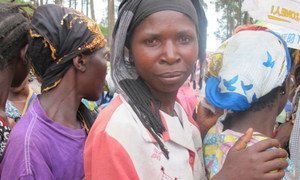 Displaced by fighting, these women queue up for food vouchers in the village of Minova, in Eastern DRC.