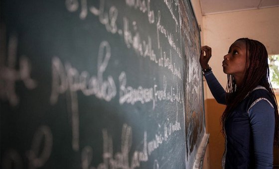 A student writes on a chalkboard at a school in Bamako, Mali.