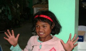 A child learning sign language in Madagascar in preparation for admittance to school.