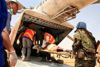 UNAMID peacekeepers evacuate wounded civilians to El Fasher for medical treatment.