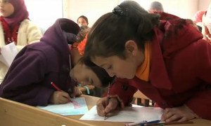 Syrian refugee children attend classes at the Za’atari camp in Jordan.
