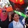 Libyan women participate in a demonstration in Tripoli calling for the disarming of armed groups.