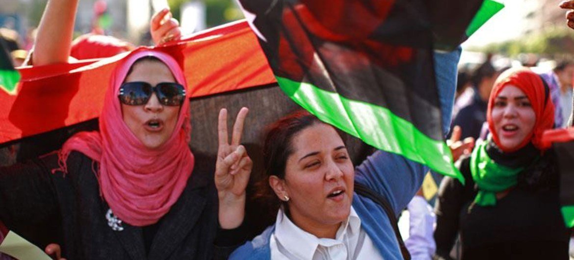 Libyan women participate in a demonstration in Tripoli calling for the disarming of armed groups.
