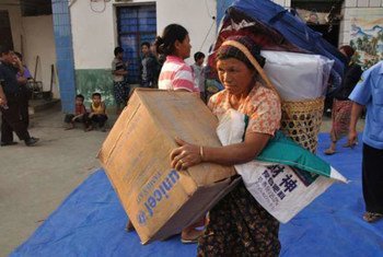 Internally displaced people in Kachin state, Myanmar, receive aid.