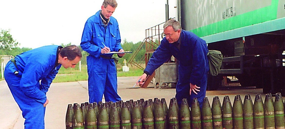 Inspectors from the Organisation for the Prohibition of Chemical Weapons (OPCW) inventory a stockpile of 22mm chemical artillery projectiles (file photo). 