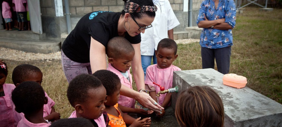 Katy Perry shows children how to wash their hands properly, during a visit a pre-school in the village of Sahavola in Analanjirofo Region, Madagascar.