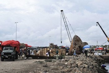 Workers offloading merchandise at the Mogadishu seaport.