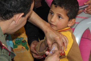 A Syrian boy gets his measles jab in Zaatari refugee camp in Jordan.