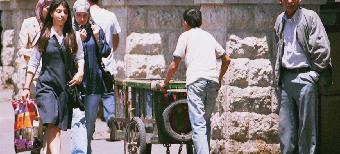 A child porter working the busy streets of East Jerusalem.