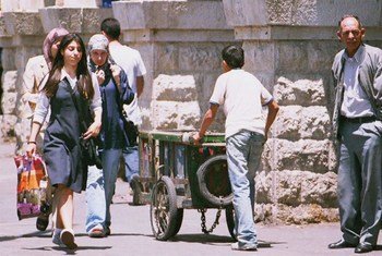 A child porter working the busy streets of East Jerusalem.